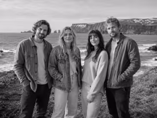 Band members on sea coast