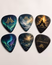 Alliance Guitar Picks Set featuring custom designs inspired by Northern Lights, Beyond The Waves, Unbroken, and the gold Alliance logo